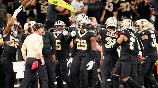 New Orleans Saints cornerback Paulson Adebo (29) celebrates intercepting a Titans pass